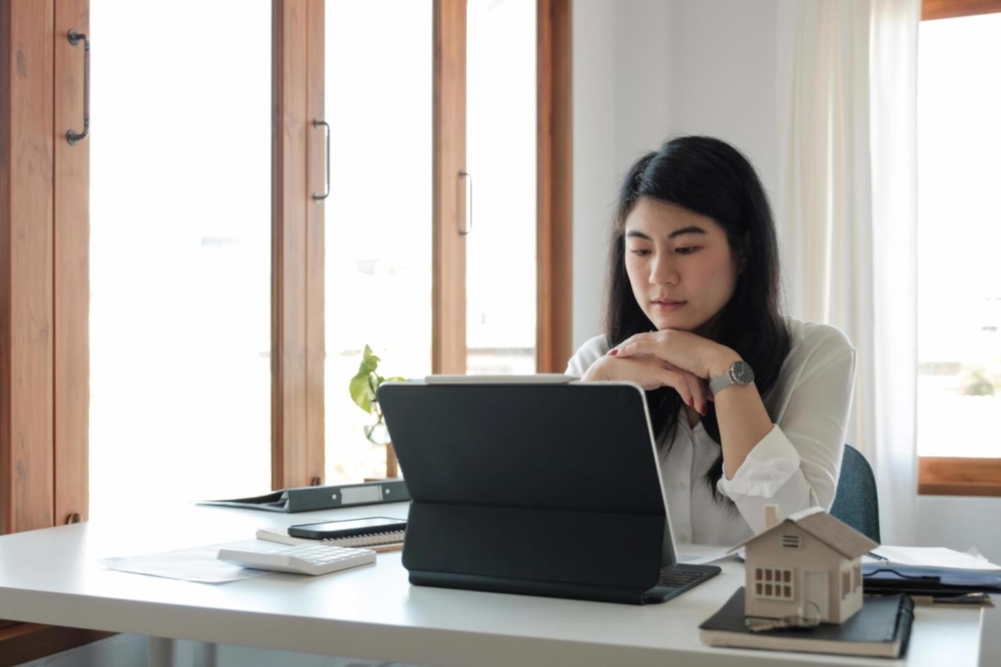 Investment community workshop with members reviewing financial documents and market data